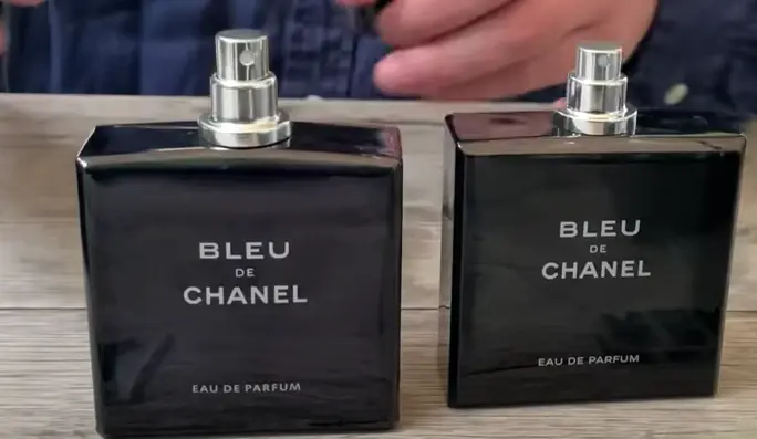 An original bottle of Bleu De Chanel will have a shorter atomizer vs the fake bottle which will have a taller atomizer