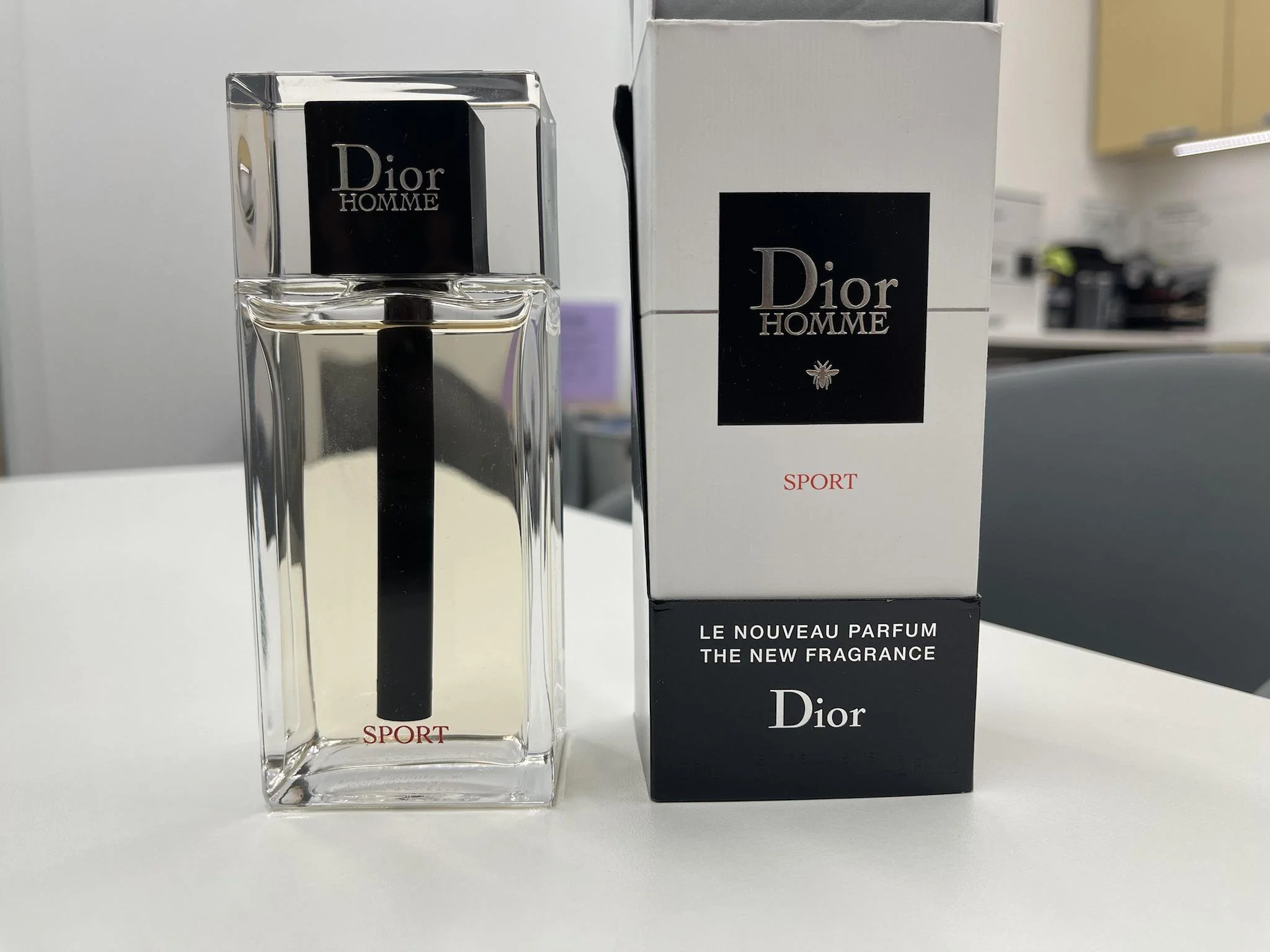 Dior Homme Sport 2021 bottle and box are shown in the picture